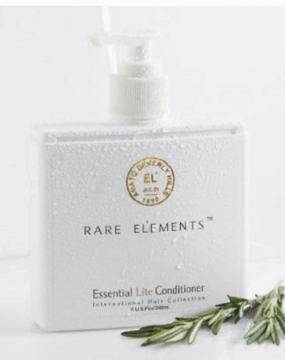 Rare Elements Essential Lite Conditioner bottle with packaging on a white background