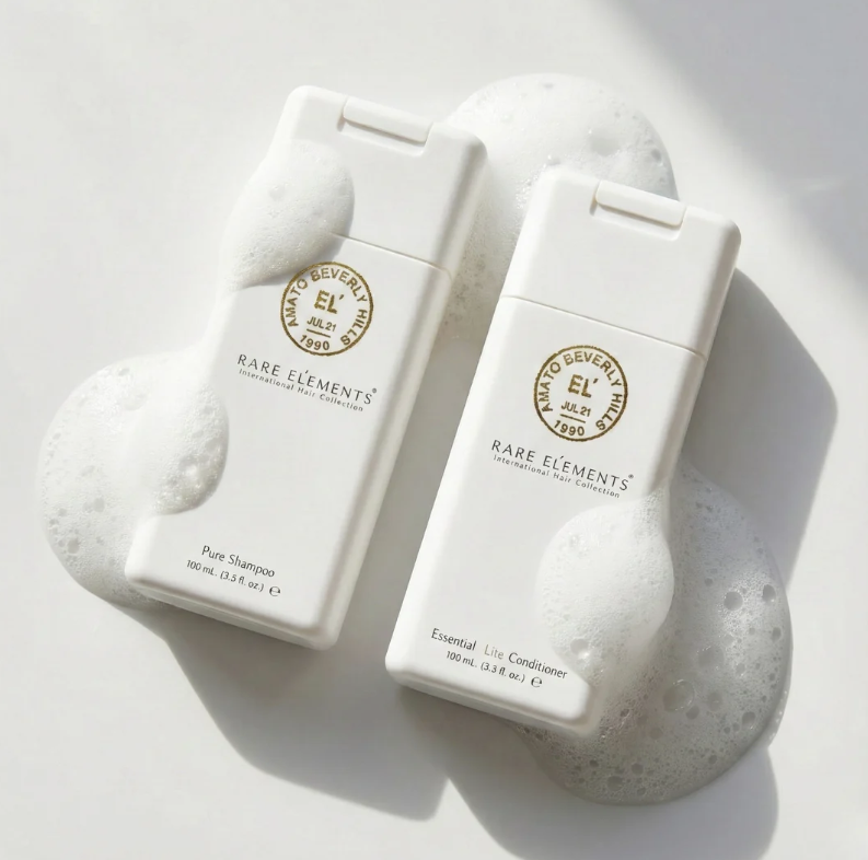 Rare Elements travel size on white background with suds.