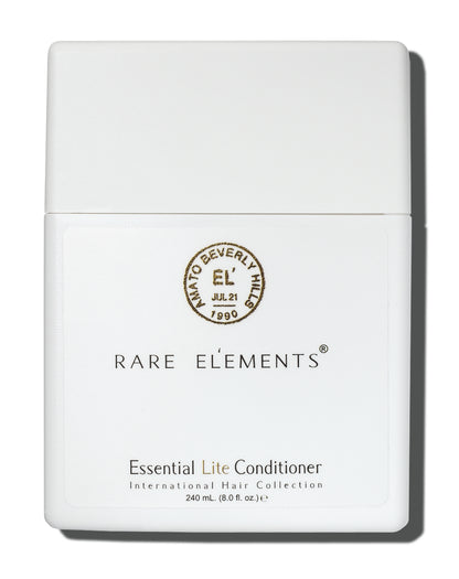 White conditioner bottle with 'Rare Elements' Essential lite conditioner on a white background