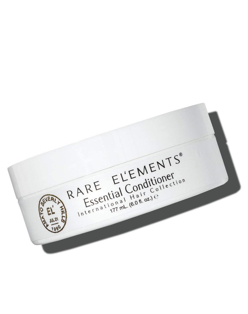 White container of Rare Elements Essential Daily Mask Conditioner on a white background
