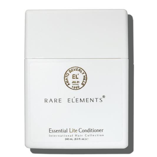 White conditioner bottle with 'Rare Elements' Essential lite conditioner on a white background